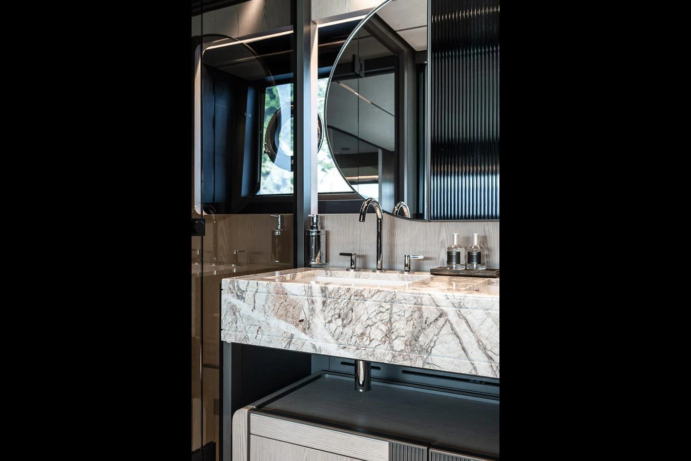 A luxurious yacht bathroom featuring a marble countertop and modern fixtures. aboard INFYNITO 80 Yacht for Sale