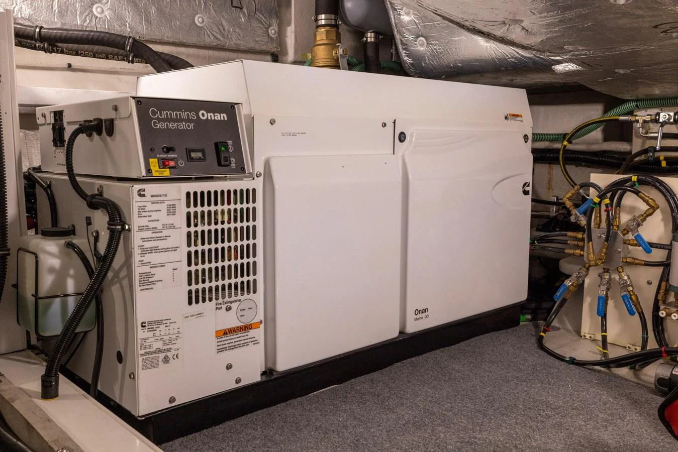 a white machine with a few wires aboard KB JR Yacht for Sale