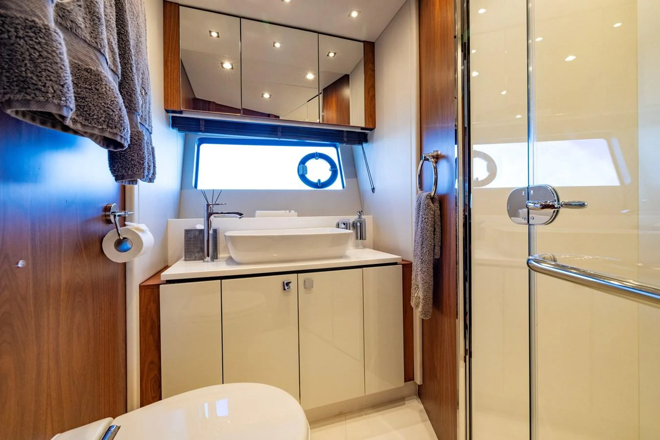 a bathroom with a sink and a mirror aboard KB JR Yacht for Sale