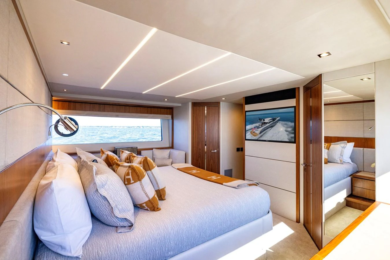 a bedroom with a large bed aboard KB JR Yacht for Sale