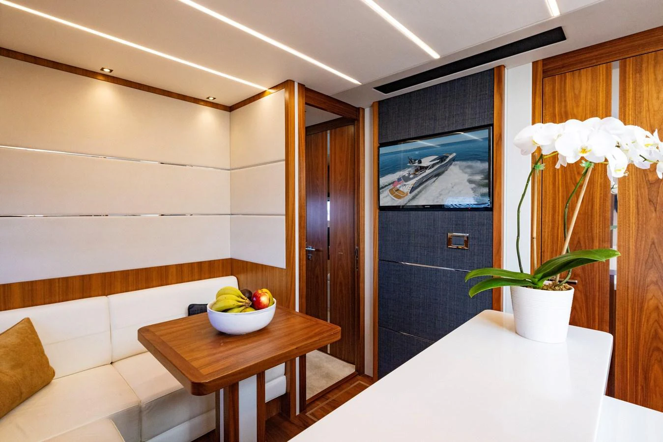 a bowl of flowers on a table aboard KB JR Yacht for Sale