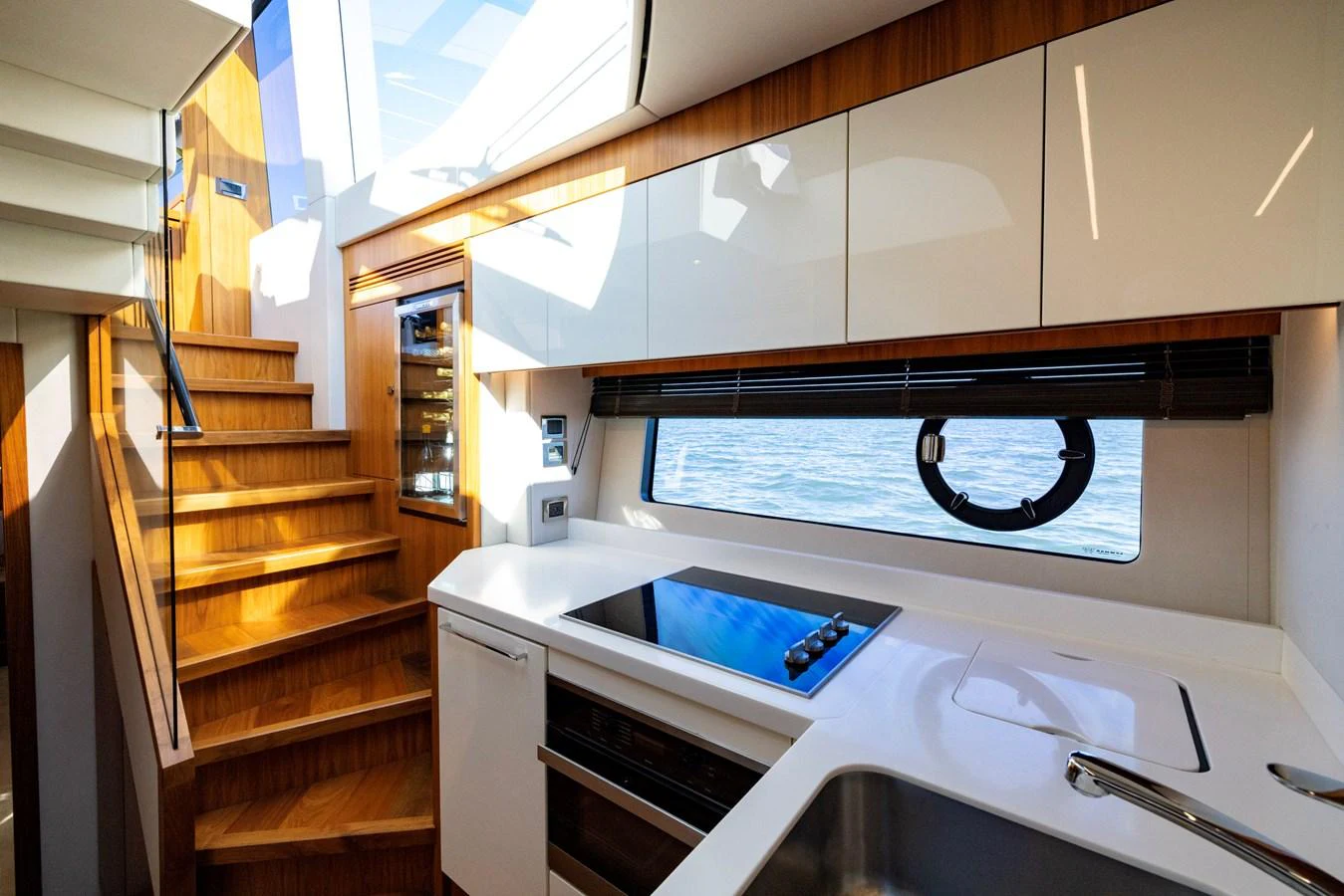 a kitchen with a sink and cabinets aboard KB JR Yacht for Sale