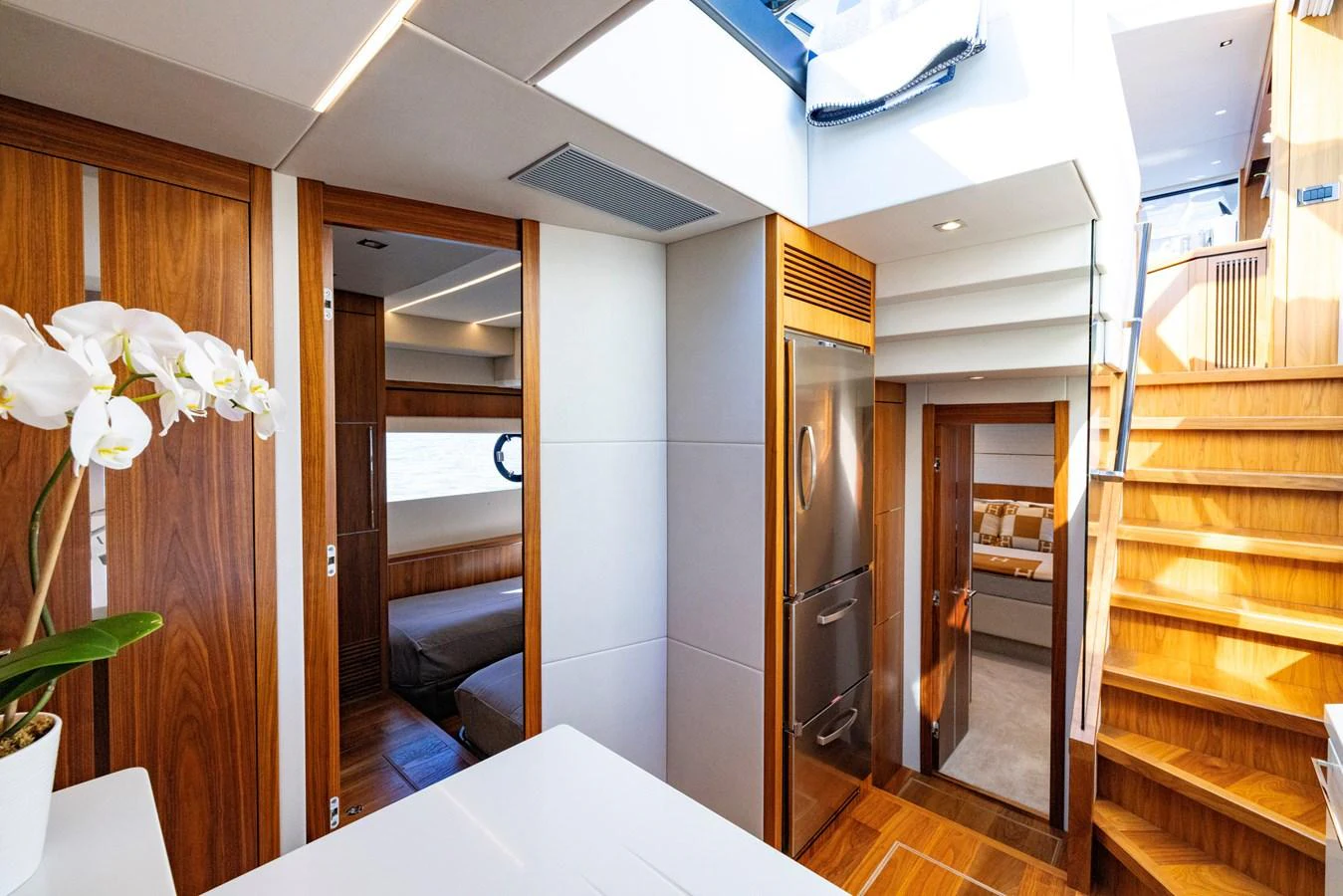 a room with a table and chairs aboard KB JR Yacht for Sale