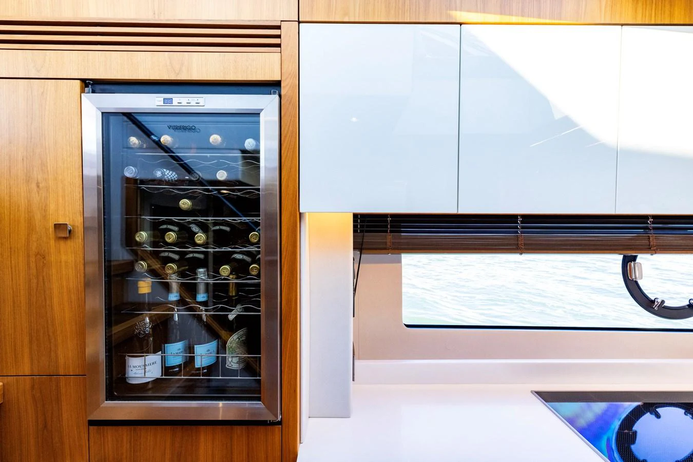 a cabinet with a vent and a glass door aboard KB JR Yacht for Sale