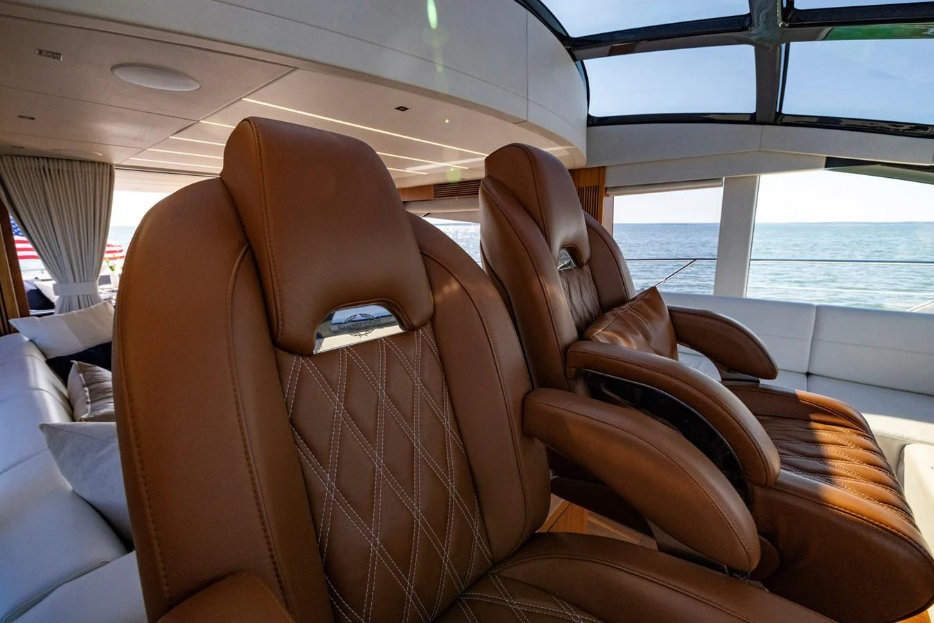 a couple of brown leather couches aboard KB JR Yacht for Sale