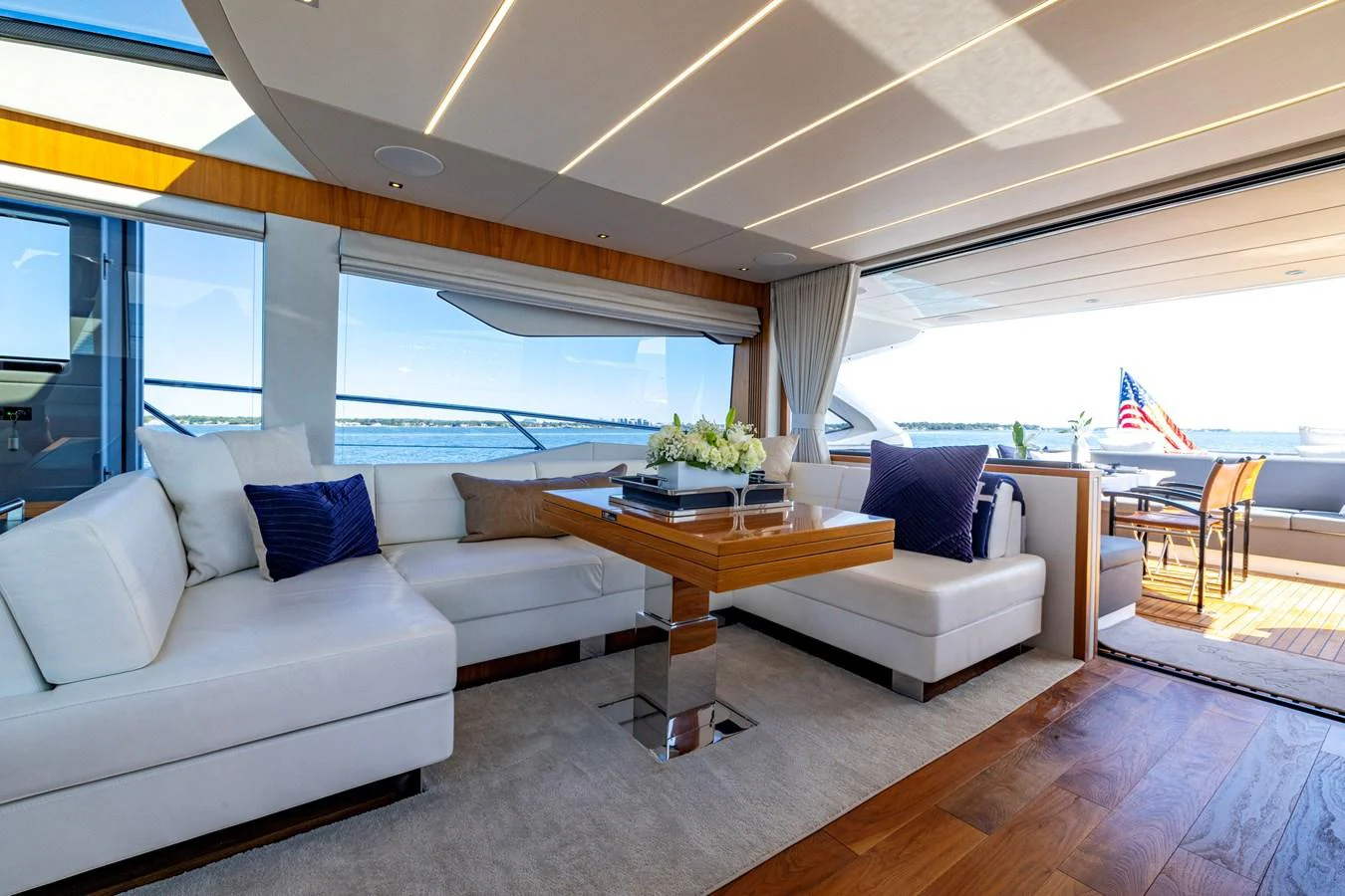 a living room with a couch and a table aboard KB JR Yacht for Sale