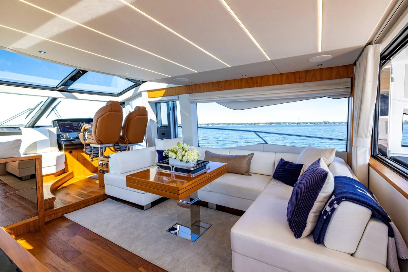 a living room with a large window aboard KB JR Yacht for Sale