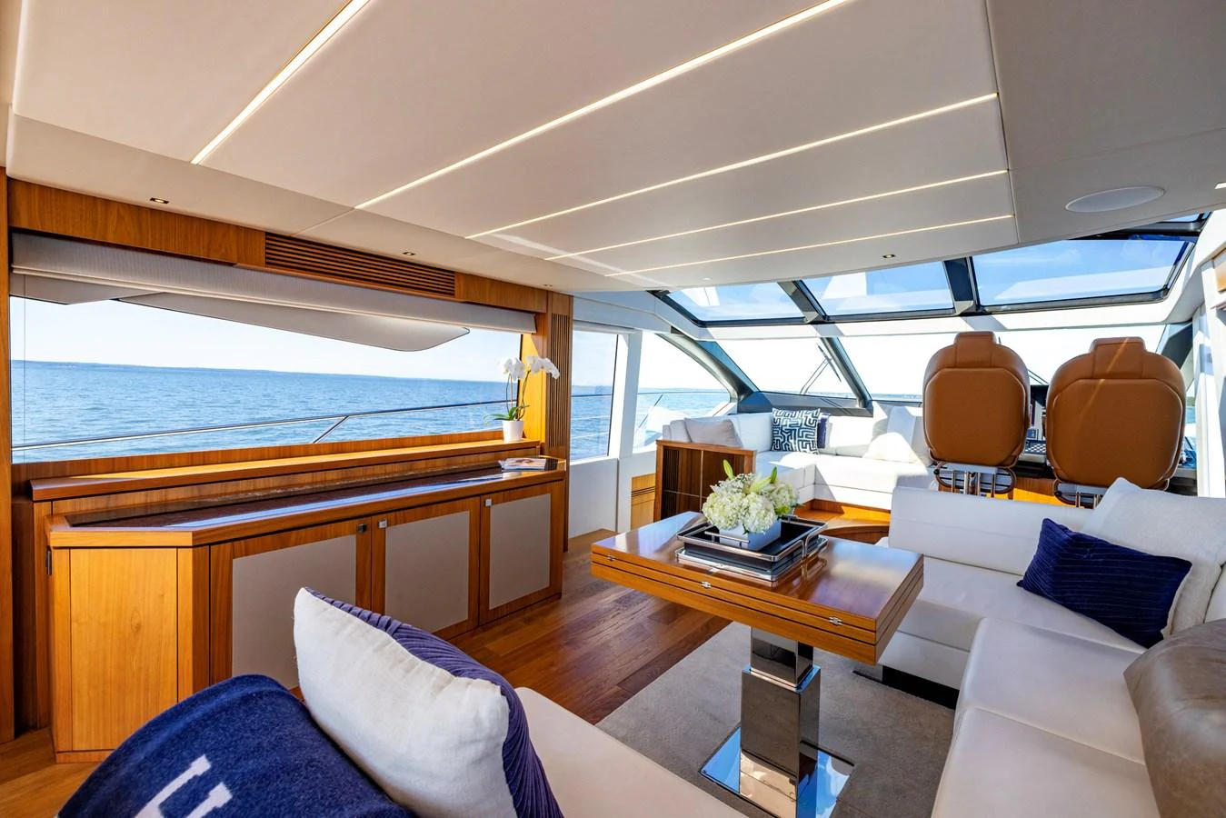 a boat with a table and chairs aboard KB JR Yacht for Sale