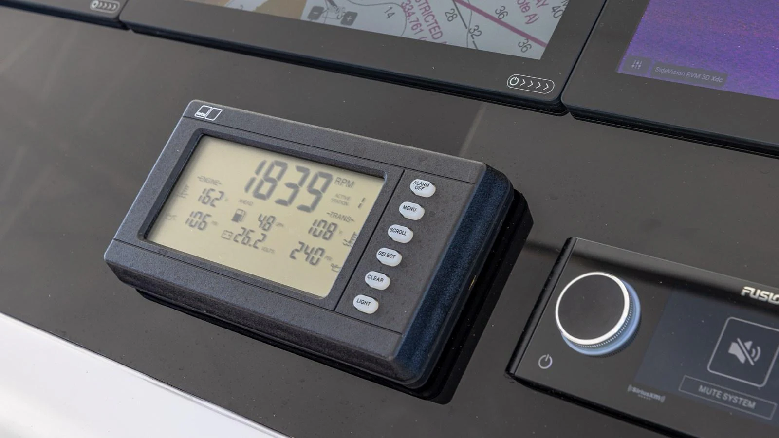 A close-up of the yacht's helm instrumentation showcasing advanced navigation and control systems. aboard FIRST BITE Yacht for Sale