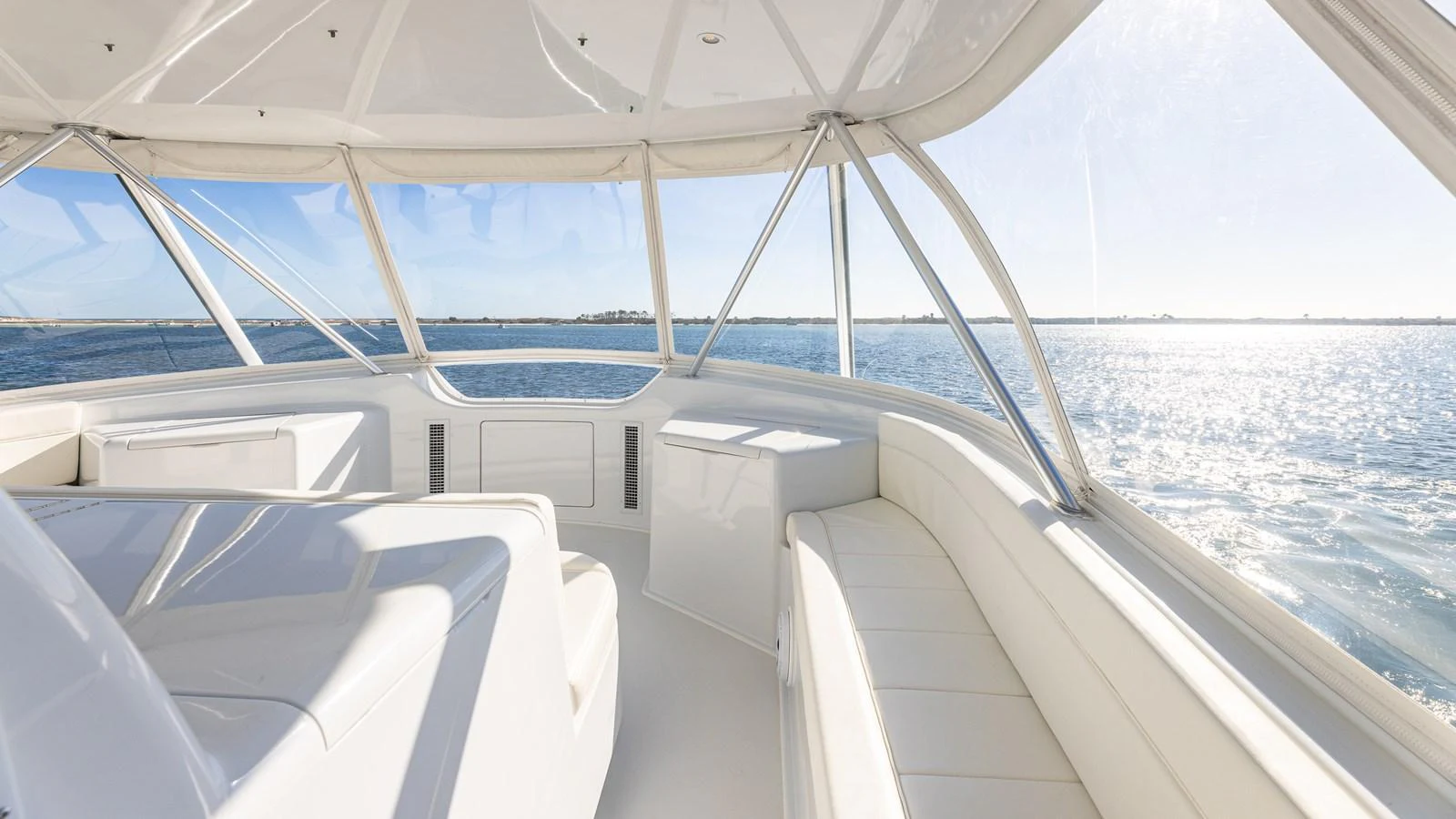 The helm area offers panoramic views with plush seating and a sleek, modern design. aboard FIRST BITE Yacht for Sale