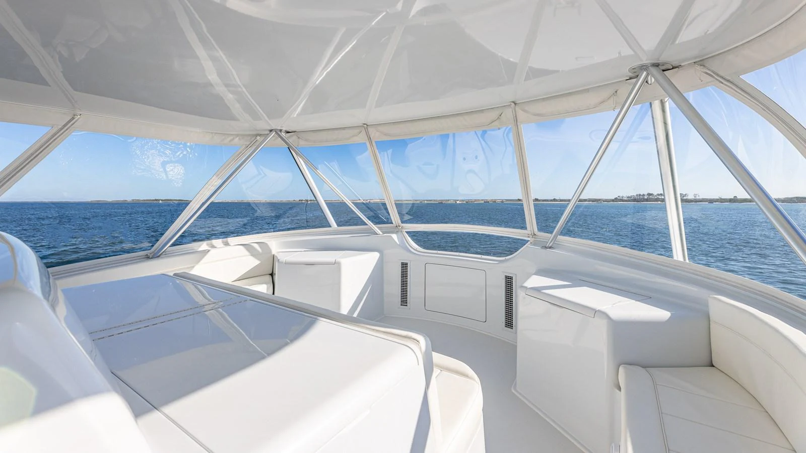The yacht's helm offers panoramic views with sleek, modern design and ample seating. aboard FIRST BITE Yacht for Sale