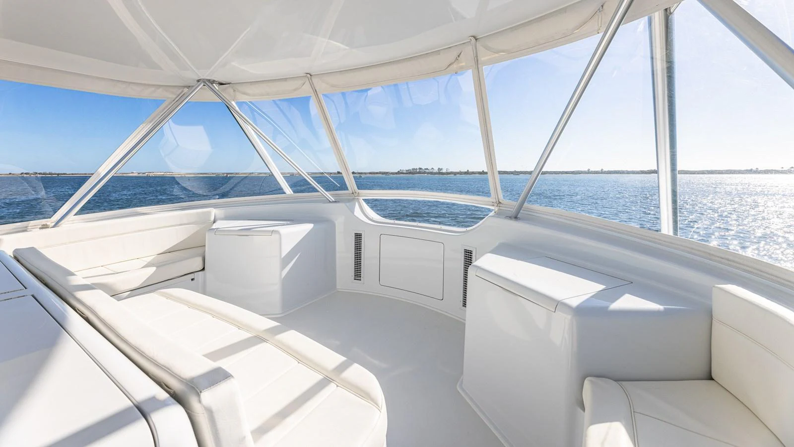The flybridge offers panoramic views with ample seating and a bright, airy atmosphere. aboard FIRST BITE Yacht for Sale