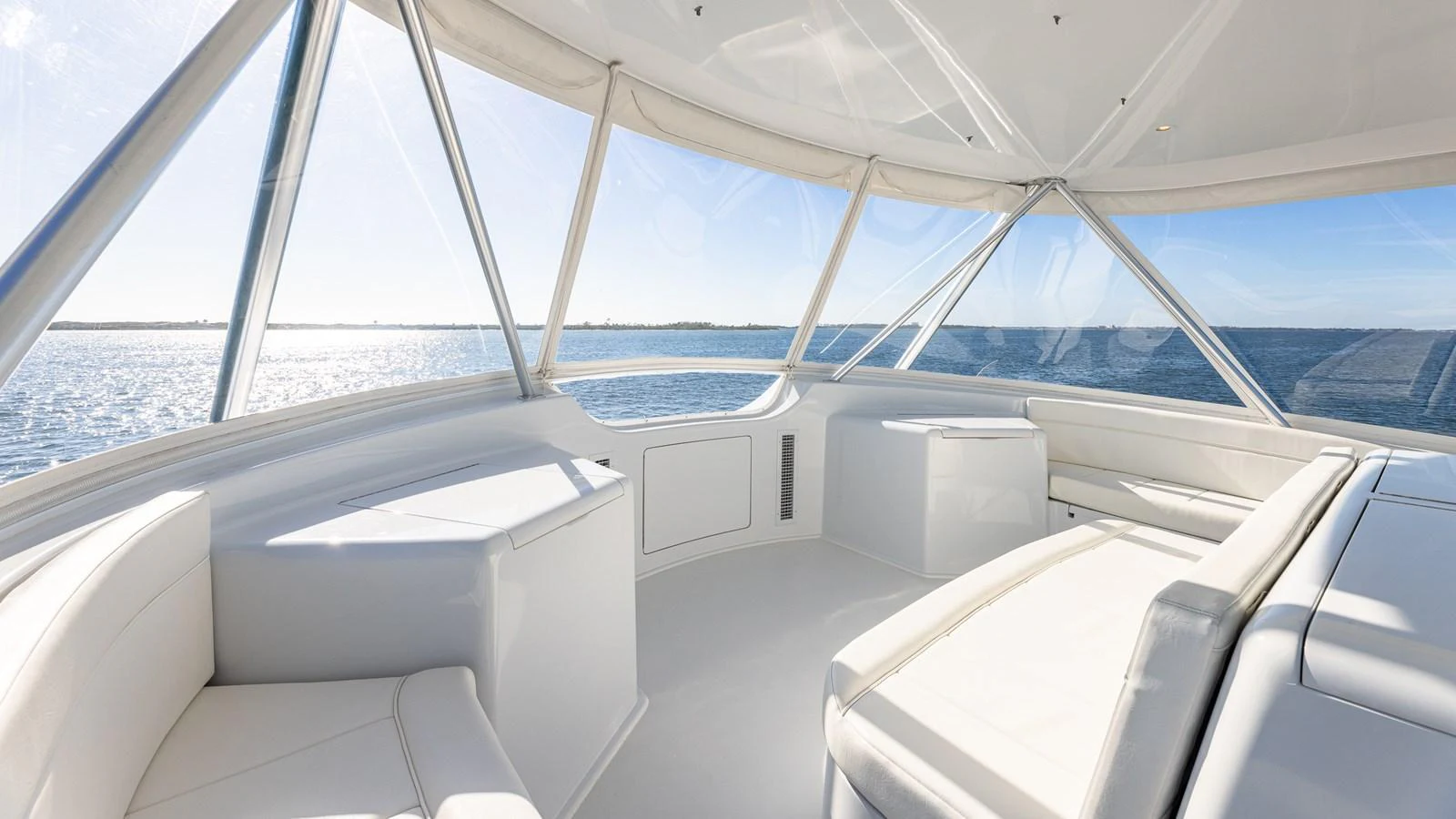 The flybridge offers panoramic views with ample seating and a bright, airy atmosphere. aboard FIRST BITE Yacht for Sale