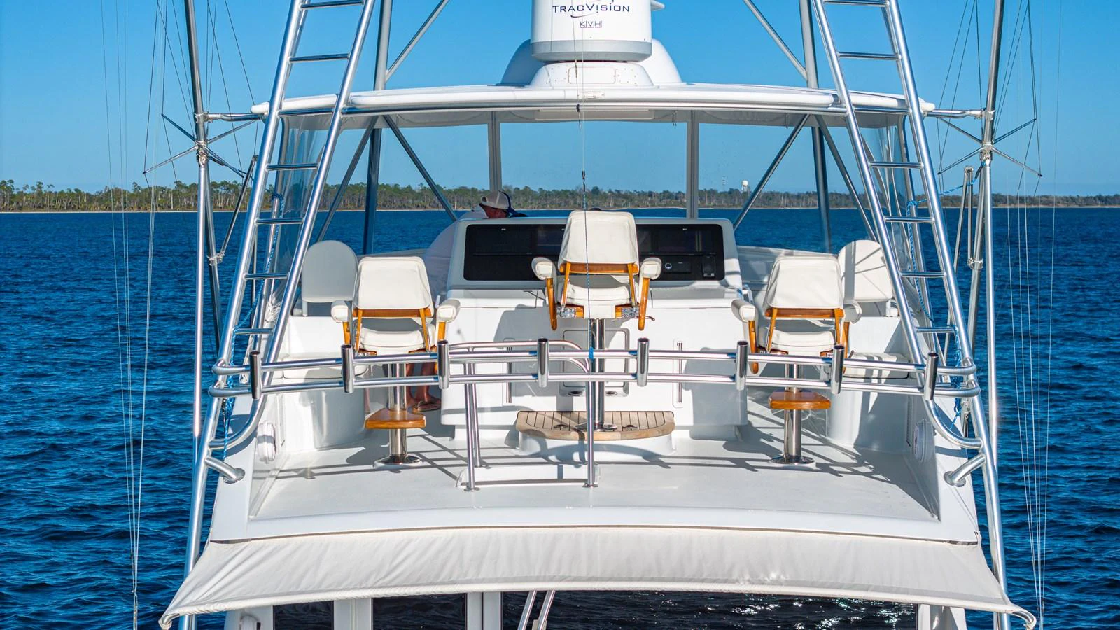 The yacht's flybridge features a sleek and modern design with comfortable seating and advanced navigation equipment. aboard FIRST BITE Yacht for Sale