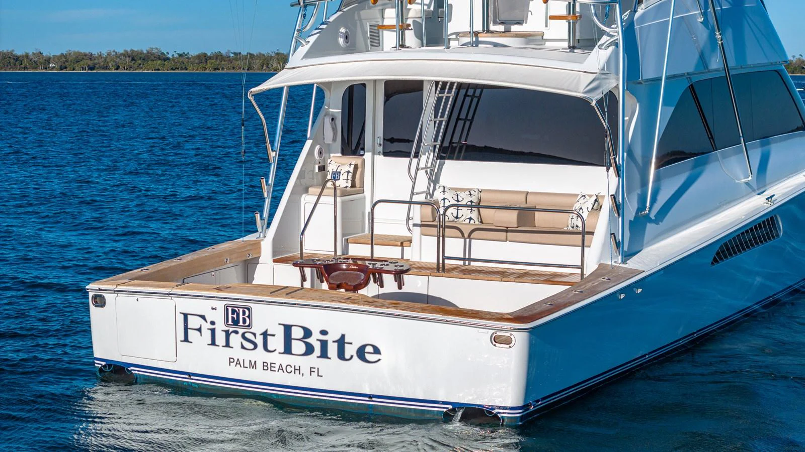 The yacht features a spacious aft deck with comfortable seating and a fishing setup, perfect for leisure and sport. aboard FIRST BITE Yacht for Sale