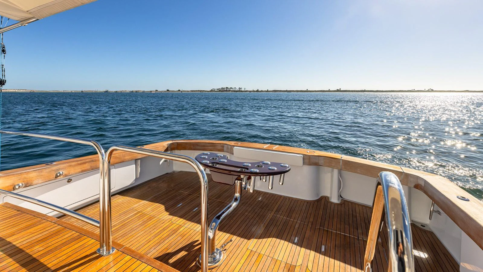 The aft deck offers a serene view of the water with ample space for relaxation. aboard FIRST BITE Yacht for Sale