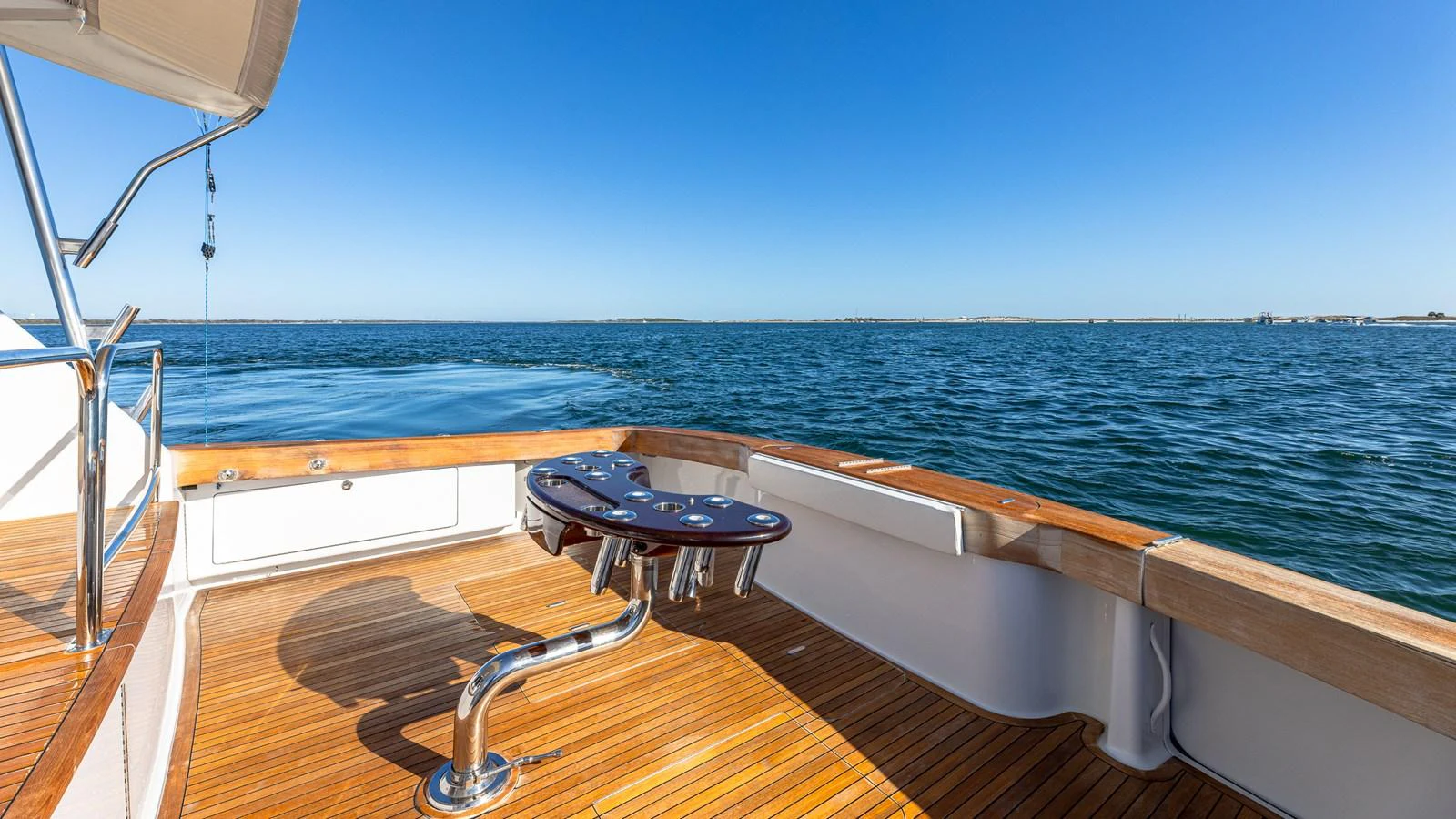 The aft deck offers a serene view of the open water, perfect for relaxation. aboard FIRST BITE Yacht for Sale