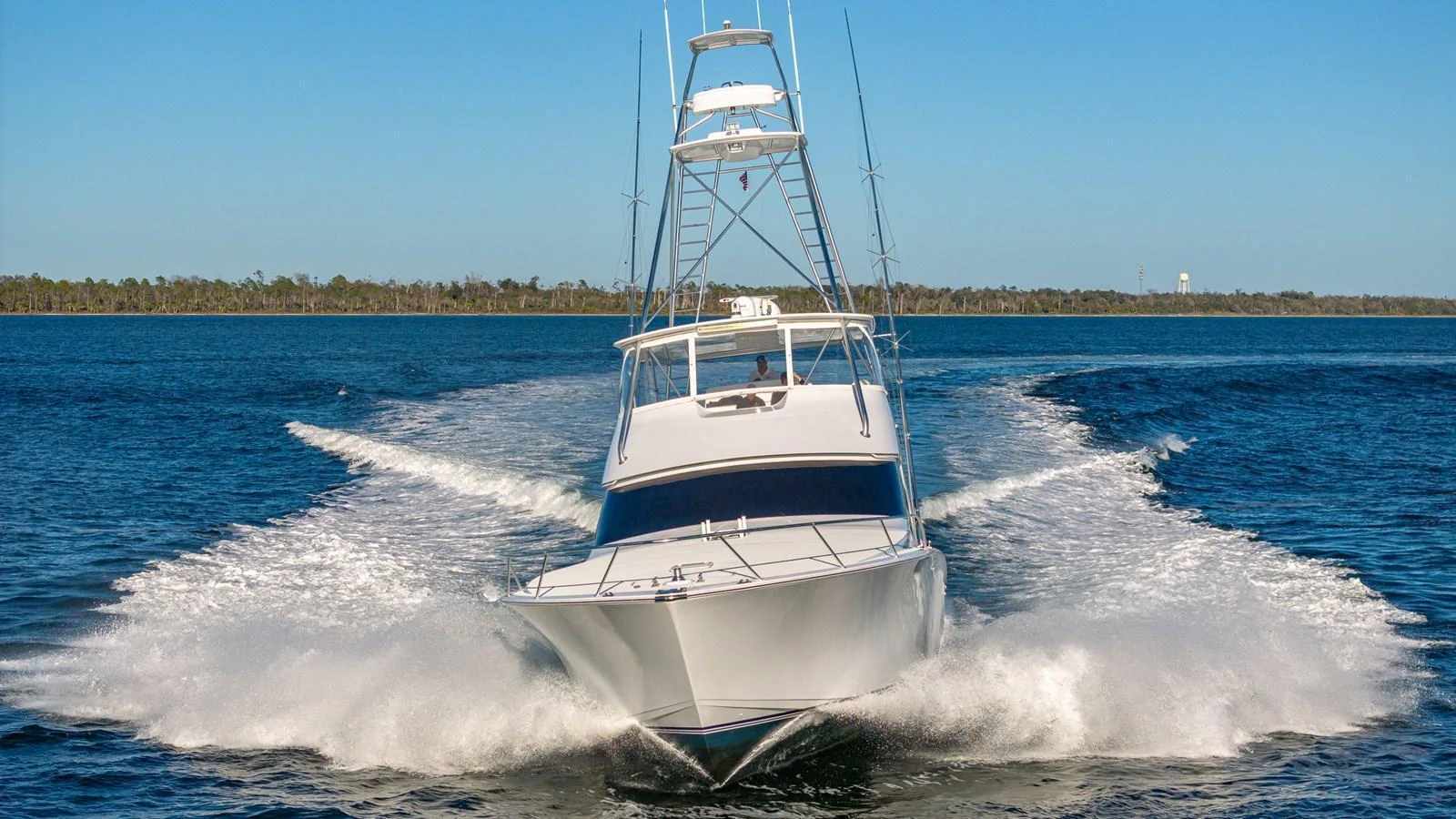 A sleek yacht cuts through the water, showcasing its powerful design and performance. aboard FIRST BITE Yacht for Sale