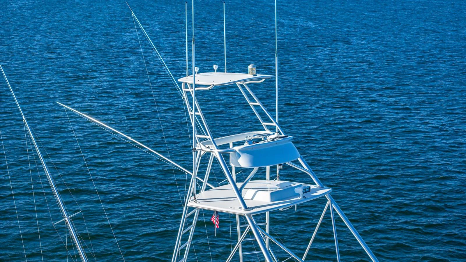 A detailed view of the yacht's flybridge against a serene blue sea. aboard FIRST BITE Yacht for Sale