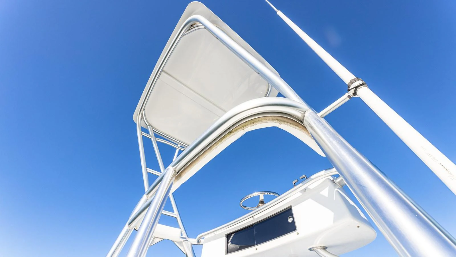 A close-up view of the yacht's tower structure against a clear blue sky. aboard FIRST BITE Yacht for Sale