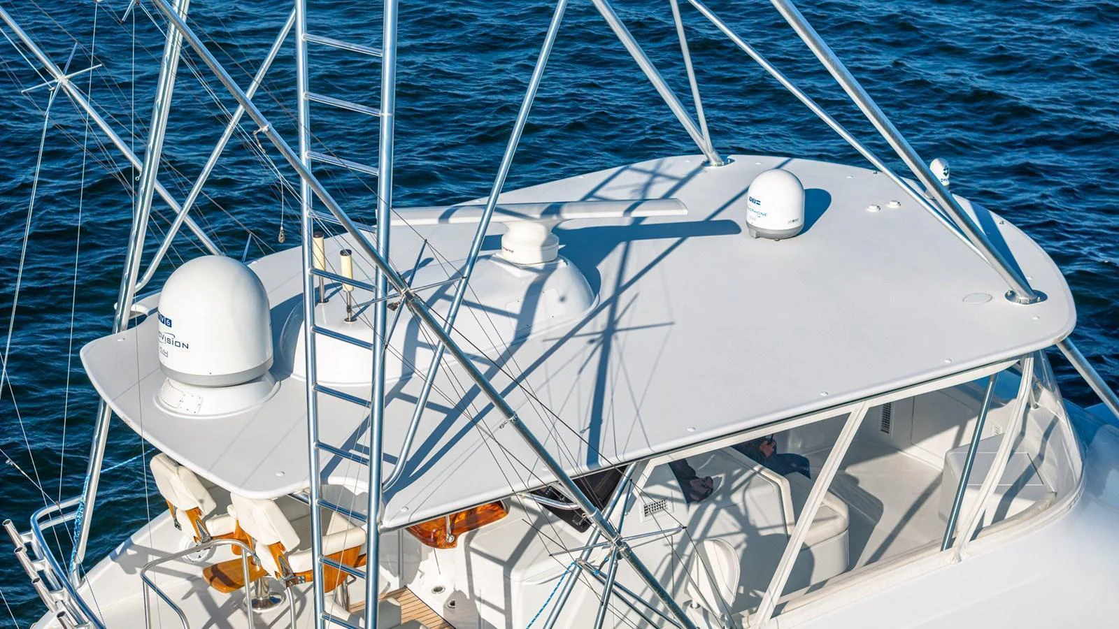 The yacht's flybridge offers a commanding view of the surrounding waters, equipped with advanced navigation equipment. aboard FIRST BITE Yacht for Sale