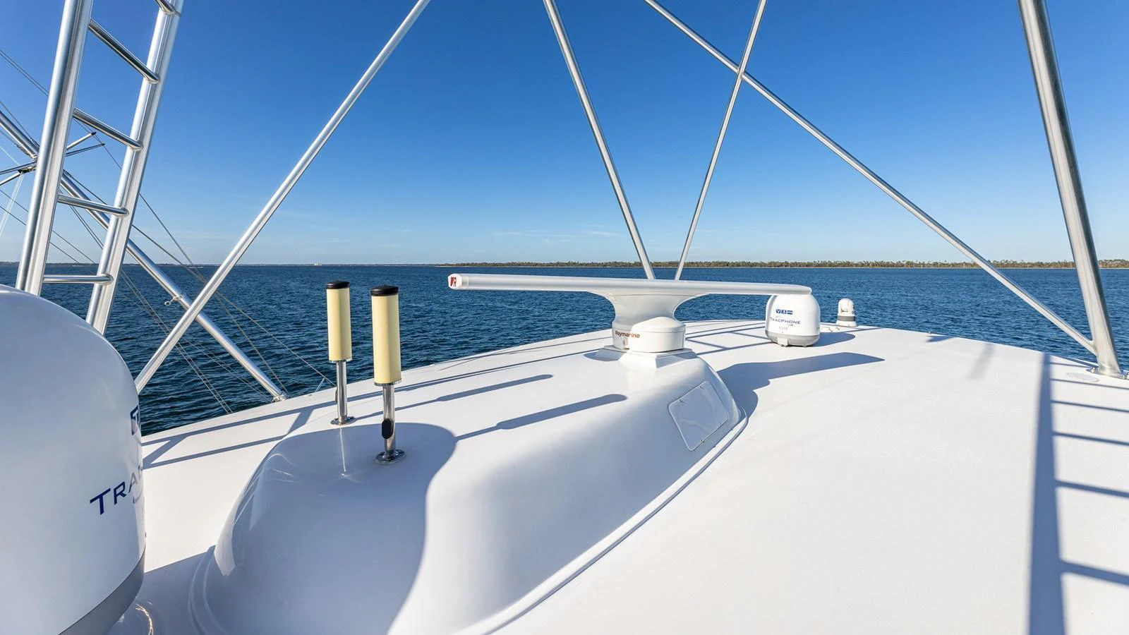 The image showcases the yacht's radar and communication equipment against a clear blue sky and calm waters. aboard FIRST BITE Yacht for Sale