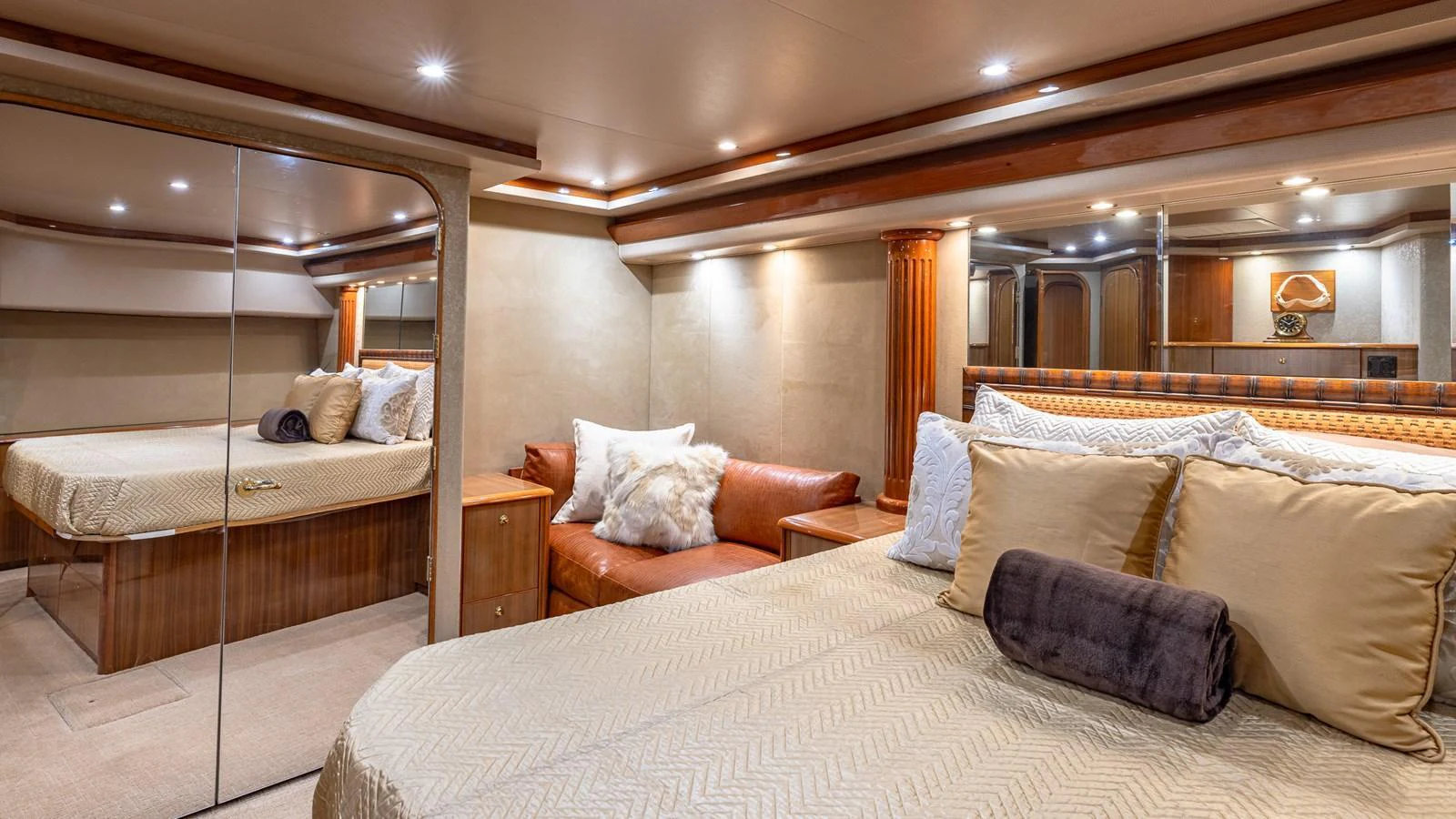 The master stateroom exudes luxury with its plush bedding, elegant wood finishes, and ambient lighting. aboard FIRST BITE Yacht for Sale
