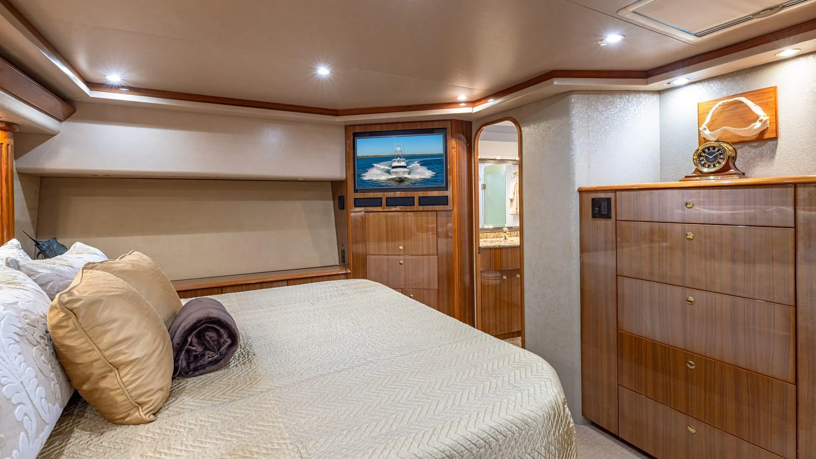 The stateroom features a comfortable bed with elegant bedding and ample storage space. aboard FIRST BITE Yacht for Sale