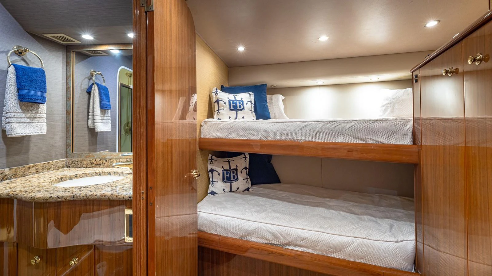 The cozy guest cabin features bunk beds and a private en-suite bathroom. aboard FIRST BITE Yacht for Sale