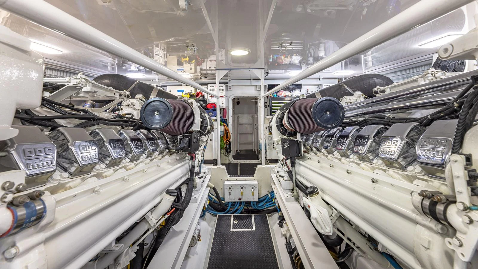 The image showcases the pristine and powerful engine room of the yacht, highlighting its advanced engineering. aboard FIRST BITE Yacht for Sale