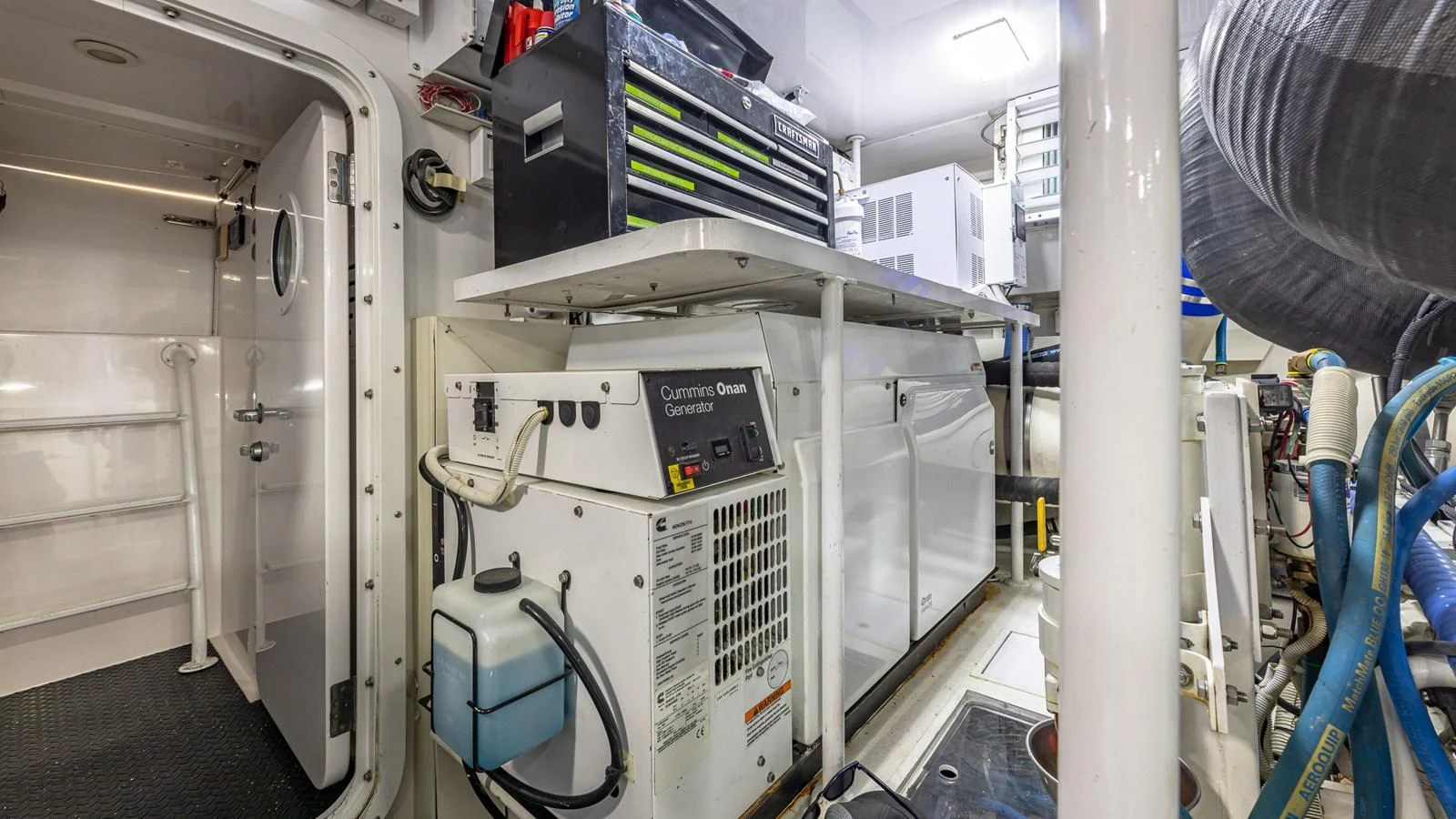 The image showcases the well-organized engine room with essential equipment and tools. aboard FIRST BITE Yacht for Sale