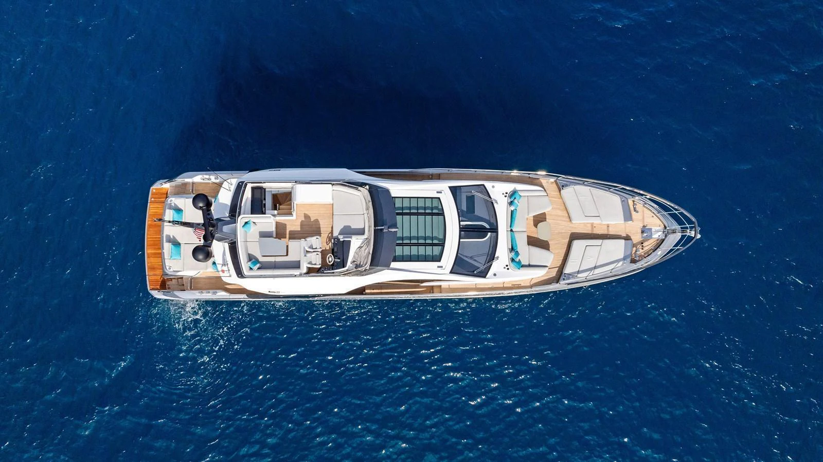 Aerial view of a luxurious yacht cruising through deep blue waters. aboard OCEAN'S SE7EN Yacht for Sale
