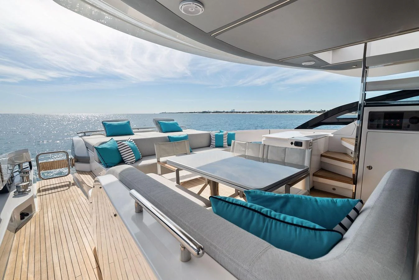The aft deck offers a spacious and inviting area for relaxation with comfortable seating and stunning ocean views. aboard OCEAN'S SE7EN Yacht for Sale