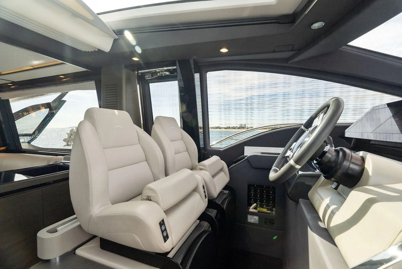 The helm station features luxurious seating and state-of-the-art navigation equipment. aboard OCEAN'S SE7EN Yacht for Sale