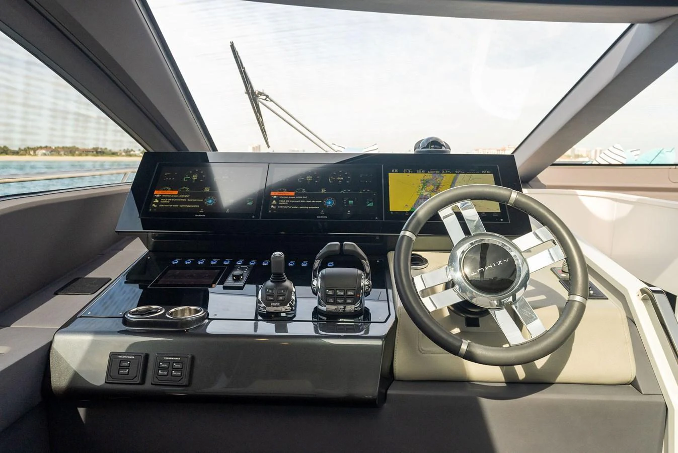 The helm station features advanced navigation equipment and a sleek steering wheel, offering a commanding view for the captain. aboard OCEAN'S SE7EN Yacht for Sale