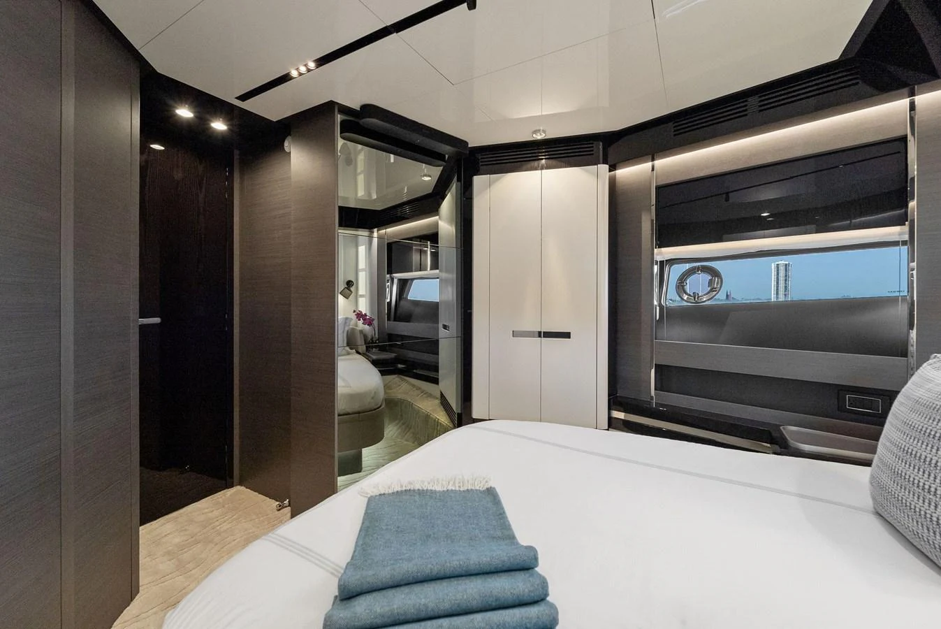 A luxurious stateroom featuring modern design elements and a serene ambiance. aboard OCEAN'S SE7EN Yacht for Sale