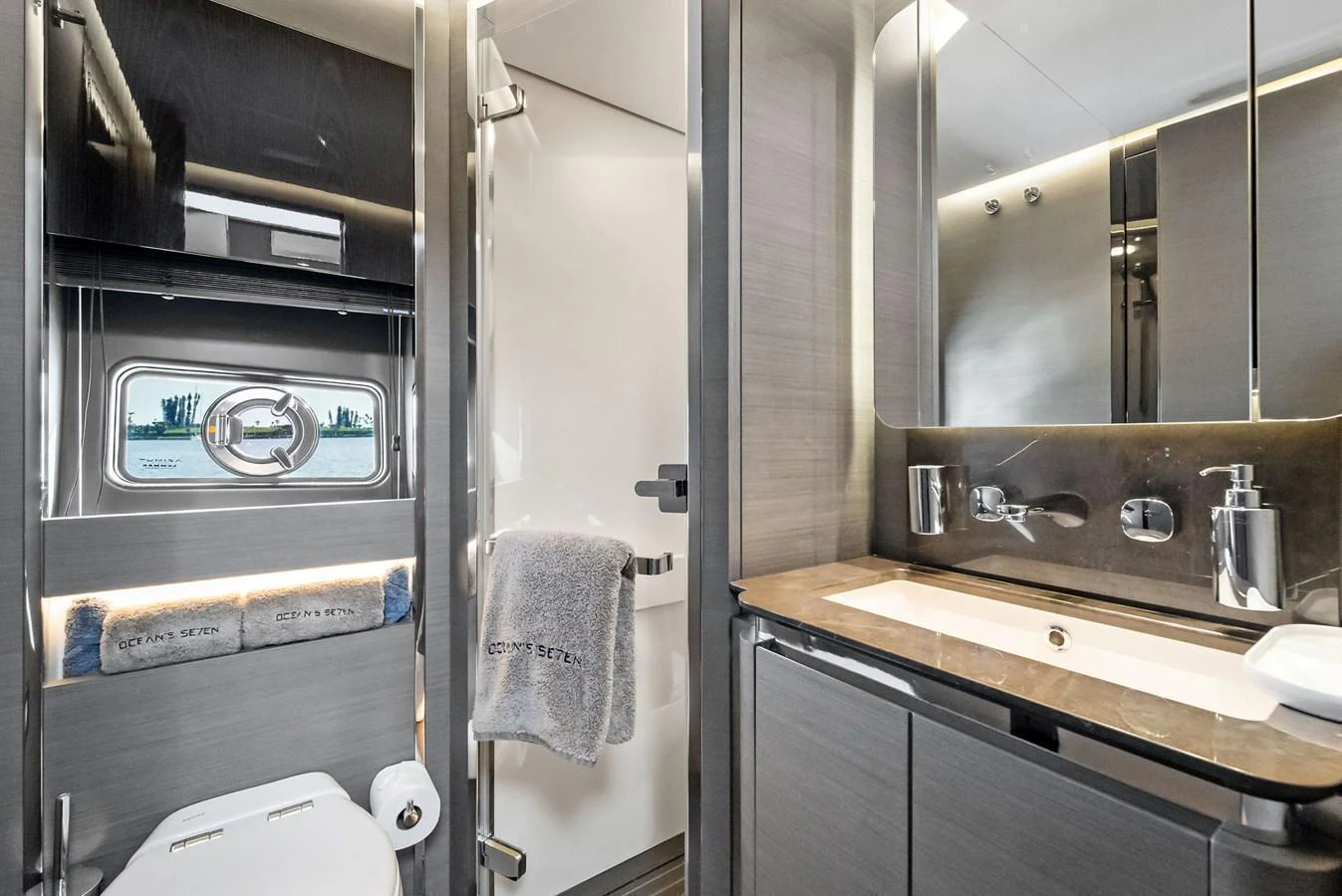 A sleek and modern bathroom with high-end fixtures and a stylish design. aboard OCEAN'S SE7EN Yacht for Sale