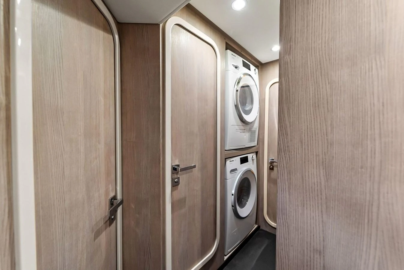 The yacht features a well-equipped laundry room with modern appliances. aboard OCEAN'S SE7EN Yacht for Sale