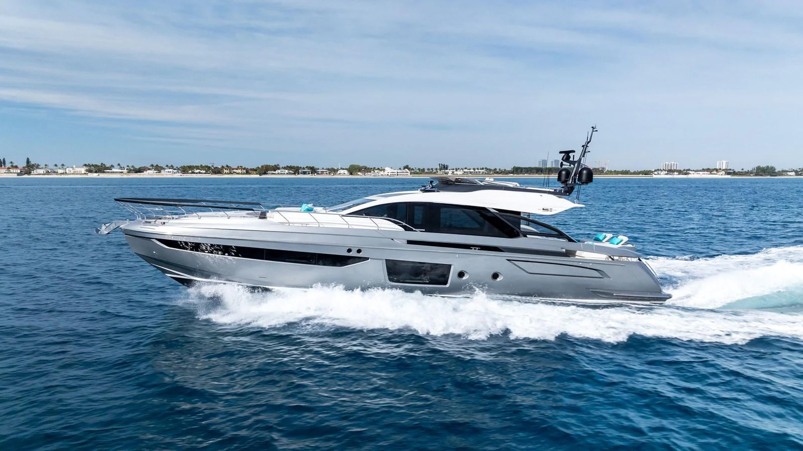 A sleek and modern yacht cruises swiftly on the open water, showcasing its elegant design and powerful performance. aboard OCEAN'S SE7EN Yacht for Sale