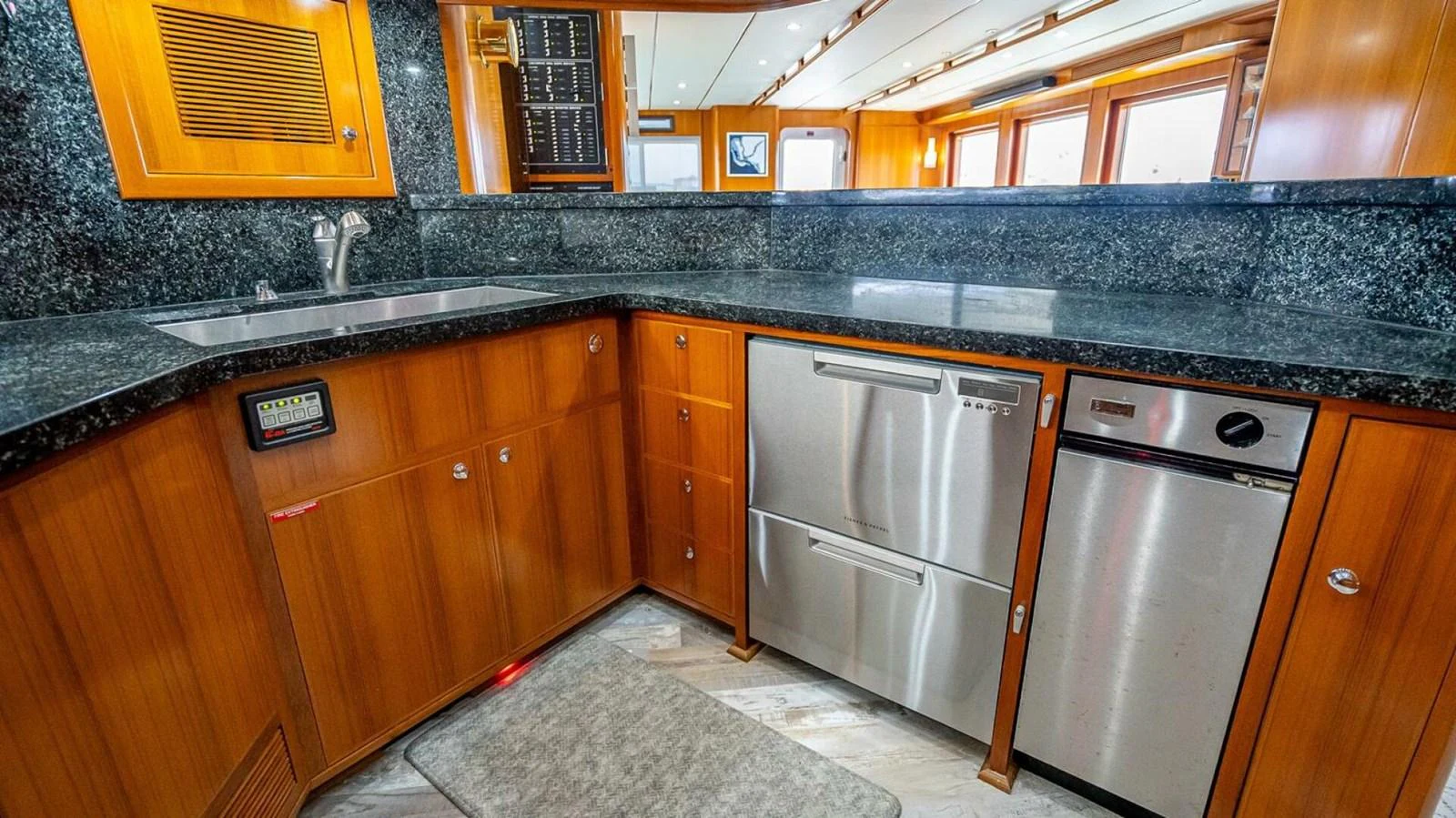 The galley features modern appliances and elegant wood cabinetry, perfect for gourmet cooking at sea. aboard TAKE 5 Yacht for Sale