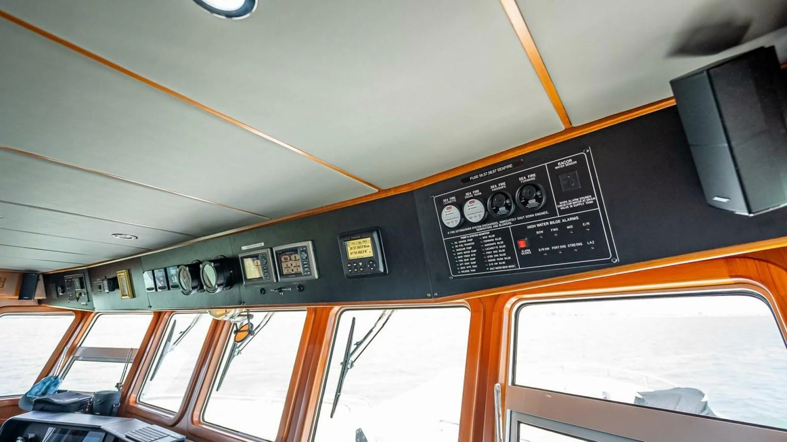 The helm station features an array of navigational instruments and large windows for optimal visibility. aboard TAKE 5 Yacht for Sale