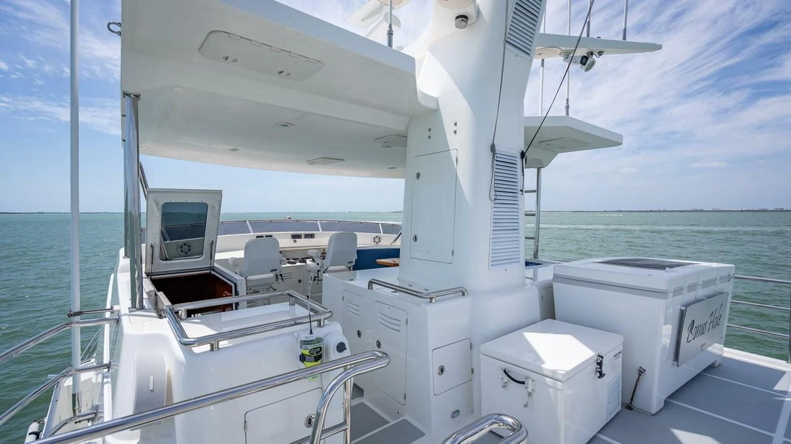 The flybridge offers a spacious and well-equipped area for relaxation and navigation. aboard TAKE 5 Yacht for Sale