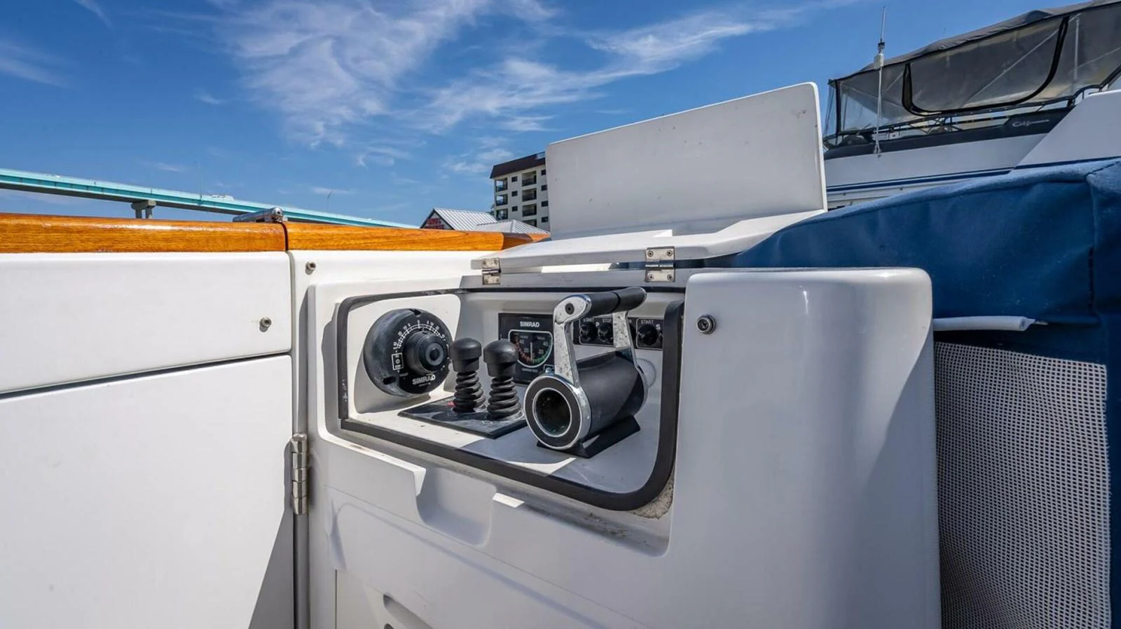 A close-up view of the yacht's control panel with various instruments and a joystick. aboard TAKE 5 Yacht for Sale