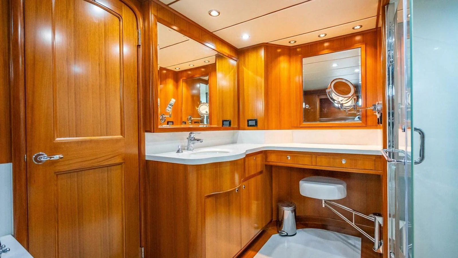 The yacht's bathroom features elegant wooden cabinetry and modern fixtures. aboard TAKE 5 Yacht for Sale