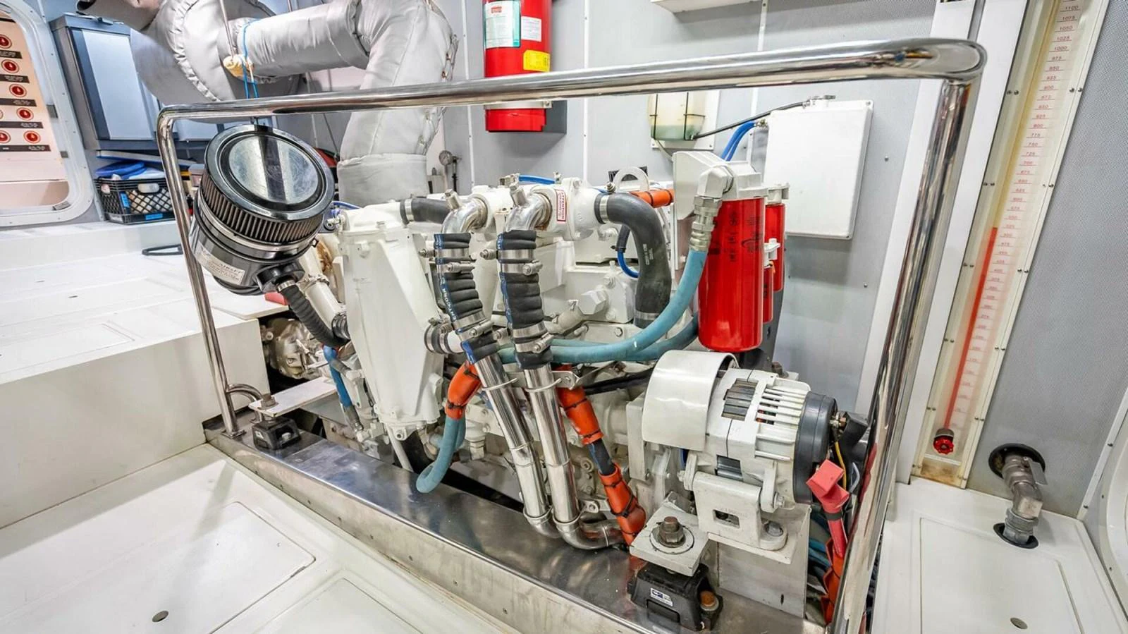 The image showcases a well-maintained engine room with visible machinery and equipment. aboard TAKE 5 Yacht for Sale