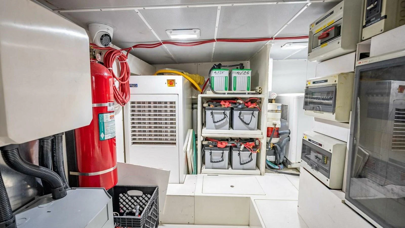 The engine room is well-organized with essential equipment and storage solutions. aboard TAKE 5 Yacht for Sale