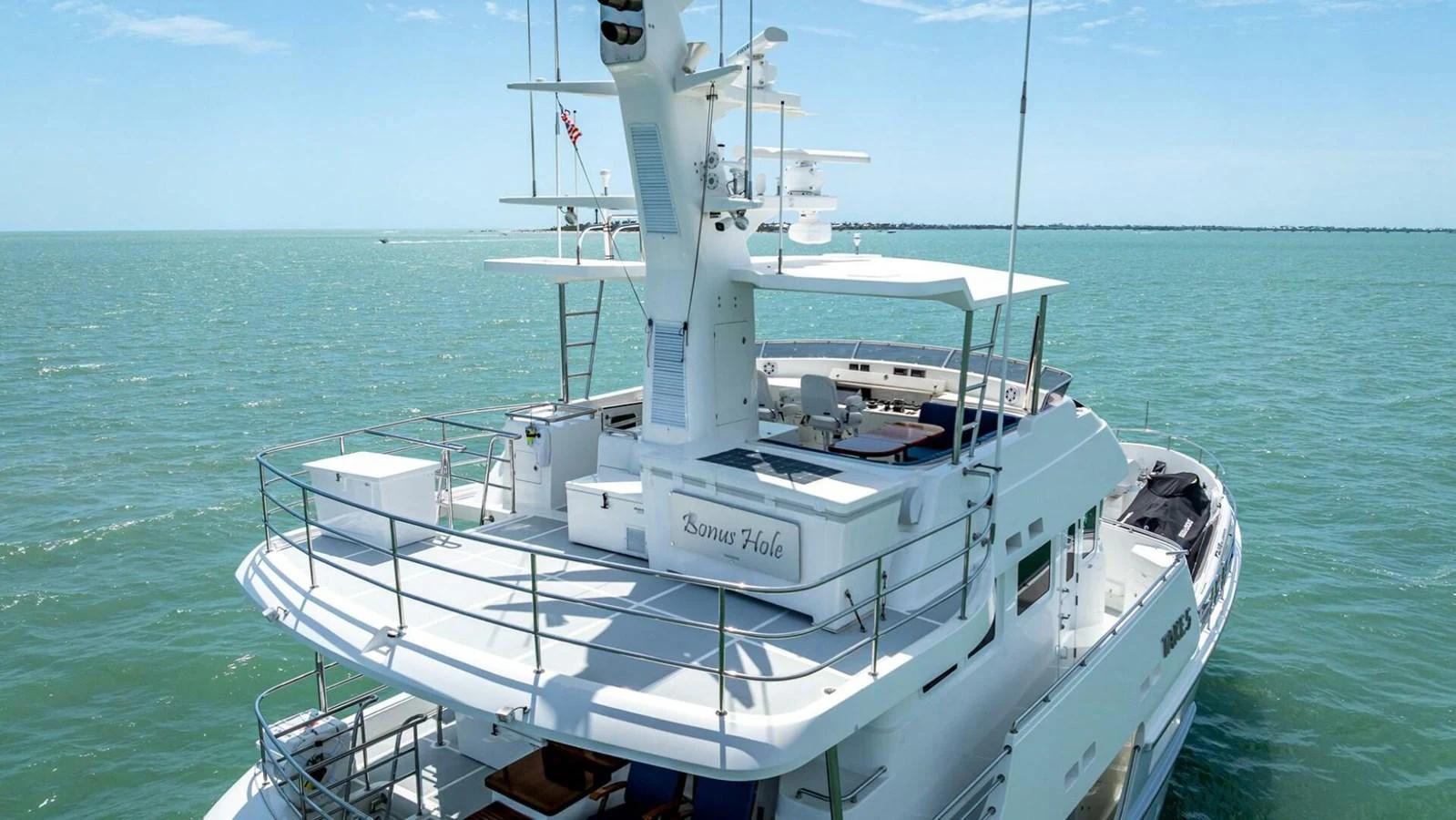 The yacht's aft deck offers a spacious and inviting area for relaxation and entertainment on the open water. aboard TAKE 5 Yacht for Sale