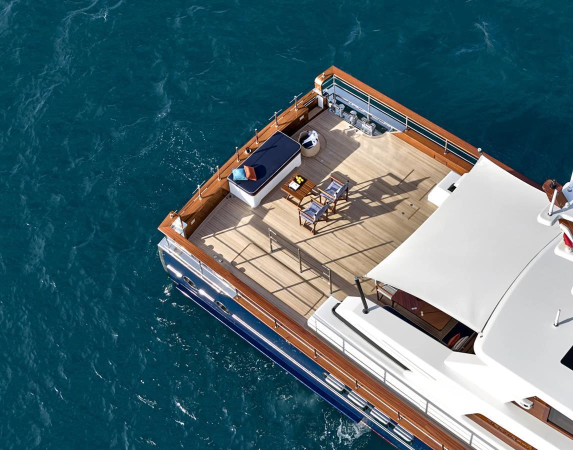 The aft deck offers a serene space with comfortable seating and a table, perfect for relaxation and dining. aboard PICCHIOTTI GENTLEMAN 24 Yacht for Sale