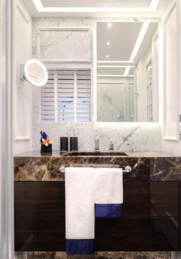 The yacht's bathroom features luxurious marble finishes and modern fixtures. aboard PICCHIOTTI GENTLEMAN 24 Yacht for Sale