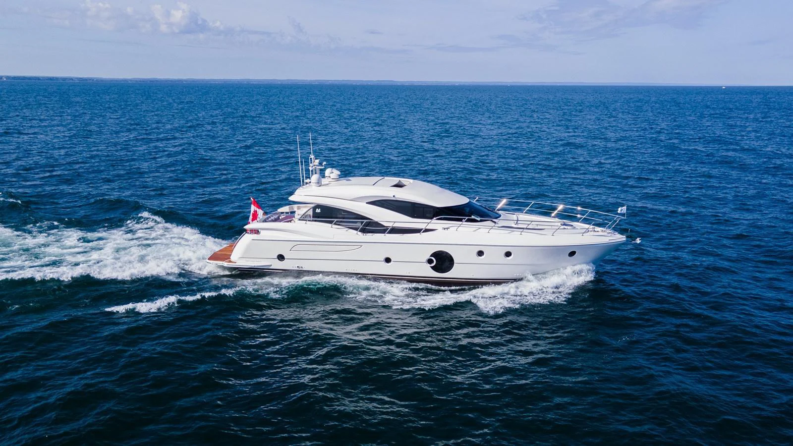 A sleek and modern yacht cruises swiftly through the open sea, showcasing its elegant design and powerful performance. aboard NEPTUNUS 650E Yacht for Sale